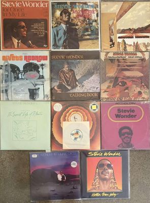 a lot of records on the floor of a room