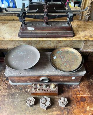 a scale and a bowl on a table in a room