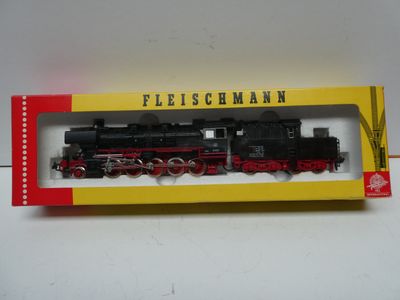 a close up of a toy train in a box on a table