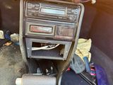a car dashboard with a radio and a steering wheel