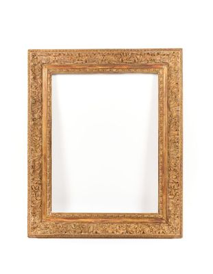 a gold frame with a white background and a white wall