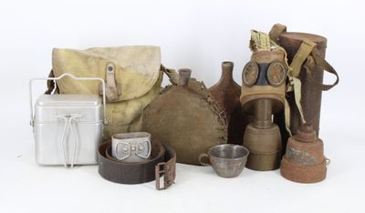 an image of a group of items including a gas mask, a bag, and other items
