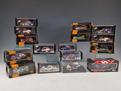 a group of toy cars and boxes on display on a table