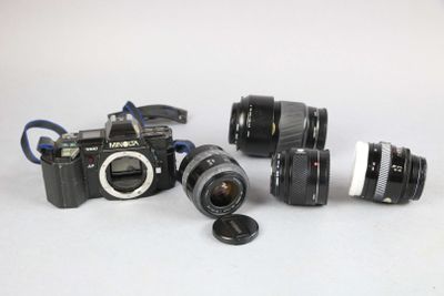 three cameras sitting next to each other on a table