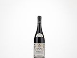 a bottle of wine sitting on top of a table