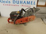 a close up of a chainsaw sitting on top of a table