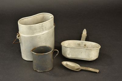 two buckets and a spoon sitting next to each other on a table
