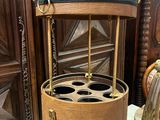 a wooden wine rack with six bottles inside of it