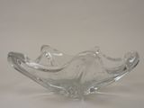 a glass bowl that is sitting on a table