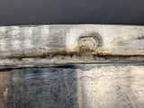 a close up view of a metal bowl with a handle