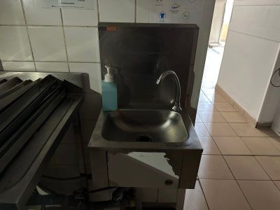 a sink in the middle of a kitchen with a lot of counter space