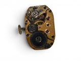 an image of a close up of a watch movement on a white surface