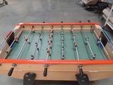 a foosball table in the middle of a living room