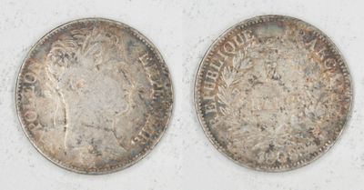 two silver coins, one of which is a woman and one of which is a man