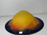 a yellow and black plate with a yellow and orange design on it