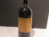a bottle of wine that is sitting on a table