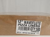 a box of pizza sitting on top of a table