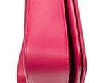 a close up of a pink purse on a white background