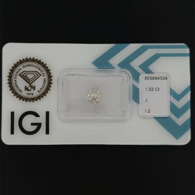 a close up of a diamond on a card on a table