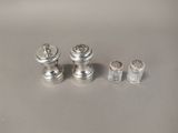 three salt and pepper shakers and a salt shaker on a table