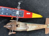 two toy airplanes that are sitting on the ground