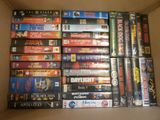 a lot of dvds in a box on the table