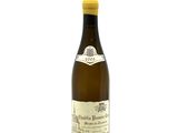 the bottle of wine is full of white wine on a white background