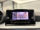 a car ' s rear view camera mounted on the dashboard of a vehicle