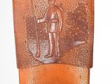 a small metal object with a soldier on it