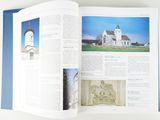an open book with a picture of a church in it