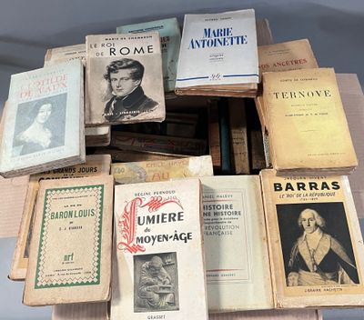 several books are stacked on top of each other on a table