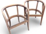 pair of wooden chairs on a white background with a white background