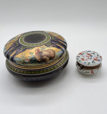 a small box with a lid and a small box with a picture on it