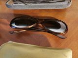 a pair of sunglasses and a case on a table