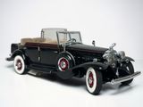 a model of a black car on a white surface