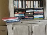 a book shelf with many books on top of it