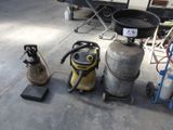 a lot of gas cans that are sitting on the floor