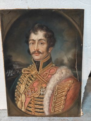 portrait d'un homme en uniforme militaire, avec une moustache et une barbichette