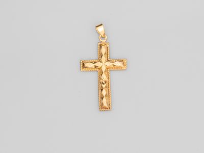 a gold cross pendant on a white background