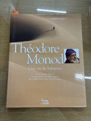 a book on a table with a picture of a man