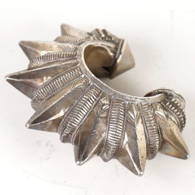 a silver metal object that is sitting on a table
