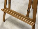 a wooden bench that is sitting on the concrete floor