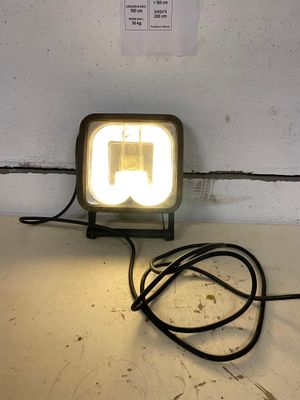 a light that is sitting on a table next to a wall