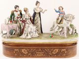 a figurine of a group of people on a horse
