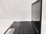 the laptop is sitting on a white surface with a black keyboard