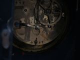 a close up of an old clock with a broken dial