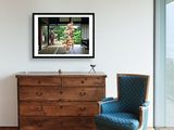 a picture of a room with a chair and a picture on the wall