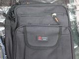 several pieces of luggage sitting on top of a table covered in plastic