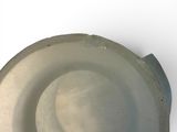 a white bowl that has a hole in the middle of it
