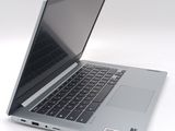 a laptop that is open on a white surface
